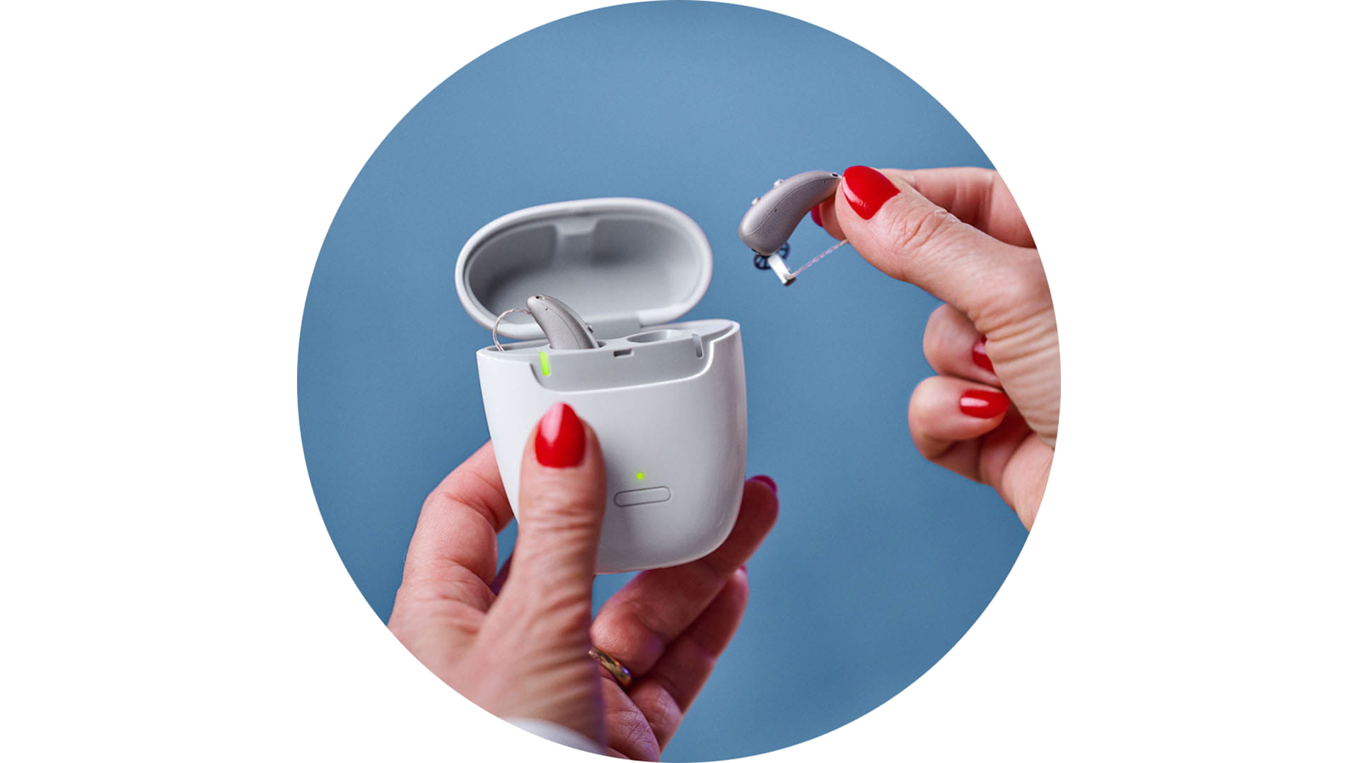 Signia CROS compatible rechargeable hearing aids in charging case.